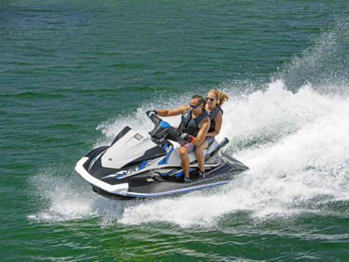 Friends riding a Sea-Doo at sunset
